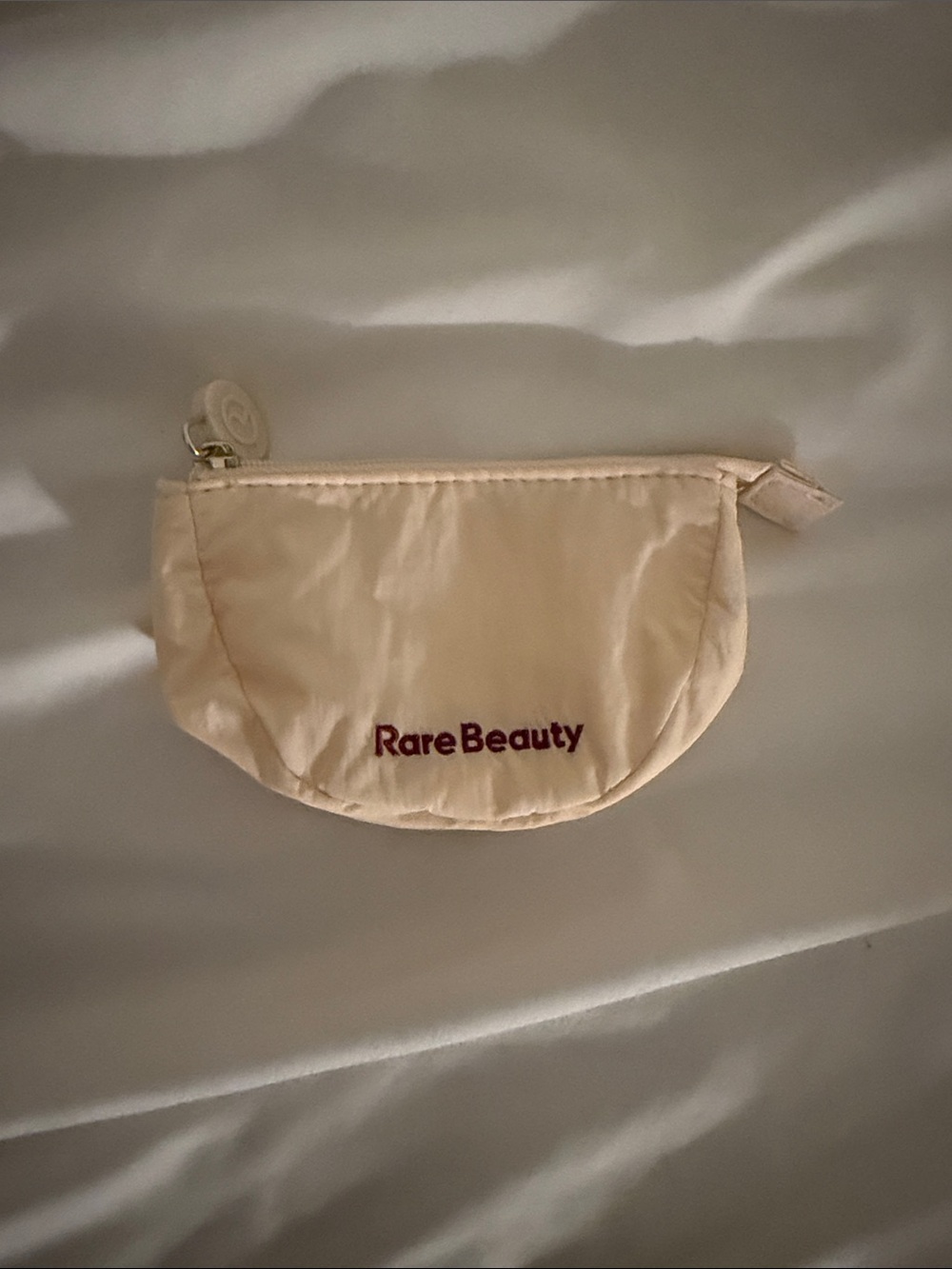 Rare Beauty Cream Cosmetic Zip Pouch with Burgundy Logo